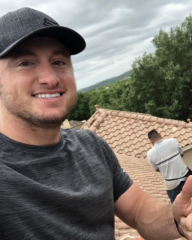 Matt Irvin on a clay tile roof during an inspection